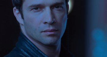 Movie still from “Resident Evil” (2002), directed by Paul W.S. Anderson – A man's face in the dark; Close Up shot, Low angle