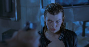 Movie still from “Resident Evil” (2002), directed by Paul W.S. Anderson – A person with wet hair; Close Up shot, Over the shoulder angle