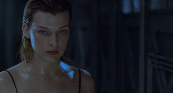 Movie still from “Resident Evil” (2002), directed by Paul W.S. Anderson – A person wearing a tank top; Close Up shot, Low angle