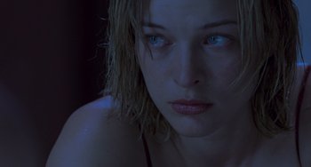 Movie still from “Resident Evil” (2002), directed by Paul W.S. Anderson – A person with wet hair; Close Up shot, Over the shoulder angle