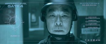 Movie still from “Resident Evil: Afterlife” (2010), directed by Paul W.S. Anderson – A person wearing a helmet; Extreme Close Up shot, Over the shoulder angle