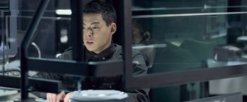 Movie still from “Resident Evil: Afterlife” (2010), directed by Paul W.S. Anderson – A man sitting in front of a window looking out; Close Up shot, Low angle