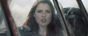 Movie still from “Resident Evil: Afterlife” (2010), directed by Paul W.S. Anderson – A person in a car; Close Up shot, Over the shoulder angle