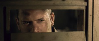 Movie still from “Resident Evil: Afterlife” (2010), directed by Paul W.S. Anderson – A person looking through a window; Close Up shot, High angle