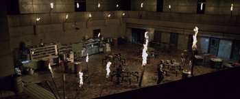 Movie still from “Resident Evil: Afterlife” (2010), directed by Paul W.S. Anderson – A group of people standing in a large room; Extreme Wide shot, High angle