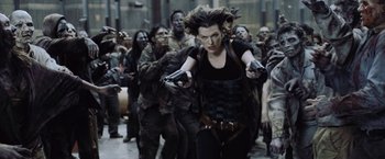 Movie still from “Resident Evil: Afterlife” (2010), directed by Paul W.S. Anderson – Milla jovovich in a scene from resident evil : the final chapter; Medium shot, Over the shoulder angle