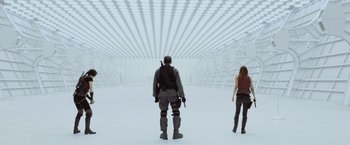 Movie still from “Resident Evil: Afterlife” (2010), directed by Paul W.S. Anderson – A man and a woman are standing in an empty room; Wide shot, Low angle