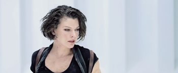 Movie still from “Resident Evil: Afterlife” (2010), directed by Paul W.S. Anderson – A person wearing a black shirt; Close Up shot, Over the shoulder angle