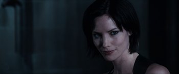 Movie still from “Resident Evil: Apocalypse” (2004), directed by Alexander Witt – A person with short hair; Close Up shot, Over the shoulder angle