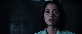 Movie still from “Resident Evil: Apocalypse” (2004), directed by Alexander Witt – A person wearing a green shirt; Close Up shot, Low angle