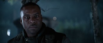 Movie still from “Resident Evil: Apocalypse” (2004), directed by Alexander Witt – A person wearing a jacket; Close Up shot, Low angle