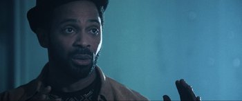 Movie still from “Resident Evil: Apocalypse” (2004), directed by Alexander Witt – A person wearing a jacket; Close Up shot, Low angle