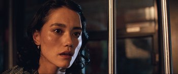 Movie still from “Resident Evil: Apocalypse” (2004), directed by Alexander Witt – A woman's face in front of a mirror; Close Up shot, Over the shoulder angle