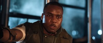 Movie still from “Resident Evil: Apocalypse” (2004), directed by Alexander Witt – A person wearing a jacket; Close Up shot, Low angle