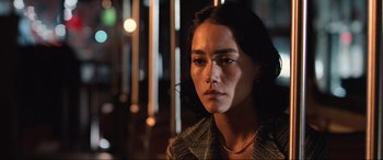 Movie still from “Resident Evil: Apocalypse” (2004), directed by Alexander Witt – A woman with long black hair wearing a jacket; Close Up shot, Low angle