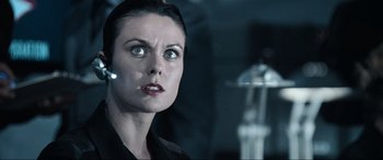 Movie still from “Resident Evil: Apocalypse” (2004), directed by Alexander Witt – A person wearing a headset; Close Up shot, Over the shoulder angle