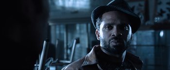 Movie still from “Resident Evil: Apocalypse” (2004), directed by Alexander Witt – A person wearing a hat; Close Up shot, Low angle