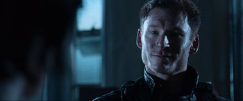 Movie still from “Resident Evil: Apocalypse” (2004), directed by Alexander Witt – A person wearing a uniform; Close Up shot, Over the shoulder angle