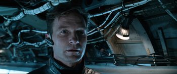 Movie still from “Resident Evil: Apocalypse” (2004), directed by Alexander Witt – A person in a room; Close Up shot, Overhead angle