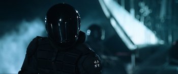 Movie still from “Resident Evil: Apocalypse” (2004), directed by Alexander Witt – A person wearing a helmet; Close Up shot, Low angle