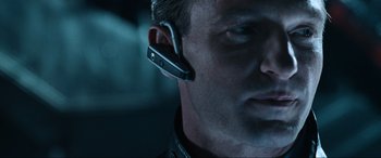 Movie still from “Resident Evil: Apocalypse” (2004), directed by Alexander Witt – A person wearing a bluetooth headset; Close Up shot, Low angle