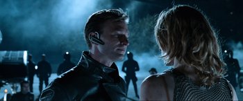 Movie still from “Resident Evil: Apocalypse” (2004), directed by Alexander Witt – A man with a headset on talking to a woman; Close Up shot, Over the shoulder angle
