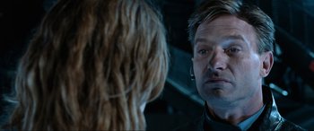 Movie still from “Resident Evil: Apocalypse” (2004), directed by Alexander Witt – A man looking at a woman in the mirror; Close Up shot, Over the shoulder angle