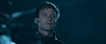 Movie still from “Resident Evil: Apocalypse” (2004), directed by Alexander Witt – A person wearing a headset; Close Up shot, Low angle