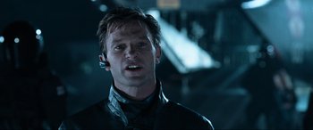 Movie still from “Resident Evil: Apocalypse” (2004), directed by Alexander Witt – A person wearing a headset; Close Up shot, Low angle