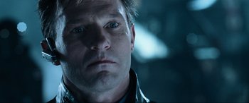 Movie still from “Resident Evil: Apocalypse” (2004), directed by Alexander Witt – A man's face in the dark; Close Up shot, Low angle