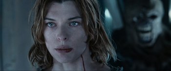 Movie still from “Resident Evil: Apocalypse” (2004), directed by Alexander Witt – A woman's face with red lipstick; Close Up shot, Low angle