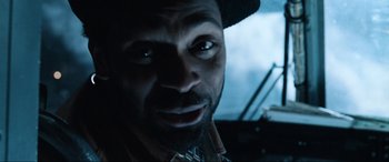 Movie still from “Resident Evil: Apocalypse” (2004), directed by Alexander Witt – A person wearing a hat; Close Up shot, Low angle