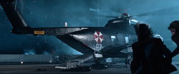 Movie still from “Resident Evil: Apocalypse” (2004), directed by Alexander Witt – An umbrella corporation helicopter parked in a parking lot at night; Wide shot, Low angle