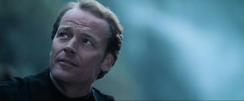 Movie still from “Resident Evil: Apocalypse” (2004), directed by Alexander Witt – A man's face with a blurry background; Close Up shot, Low angle