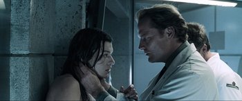 Movie still from “Resident Evil: Apocalypse” (2004), directed by Alexander Witt – A man and a woman looking at one another; Close Up shot, Low angle