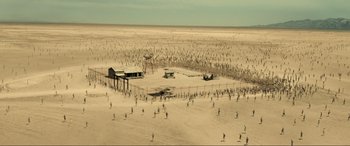 Movie still from “Resident Evil: Extinction” (2007), directed by Russell Mulcahy – An aerial view of an area with a lot of people in it; Extreme Wide shot, High angle