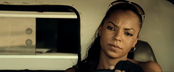 Movie still from “Resident Evil: Extinction” (2007), directed by Russell Mulcahy – A person sitting on a bus; Close Up shot, Over the shoulder angle