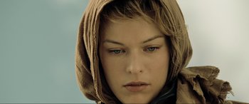 Movie still from “Resident Evil: Extinction” (2007), directed by Russell Mulcahy – A person wearing a hooded jacket; Close Up shot, Low angle