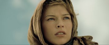 Movie still from “Resident Evil: Extinction” (2007), directed by Russell Mulcahy – A person wearing a hooded jacket; Close Up shot, Low angle