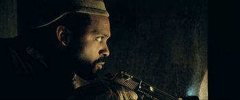 Movie still from “Resident Evil: Extinction” (2007), directed by Russell Mulcahy – A person holding a camera; Close Up shot, Overhead angle