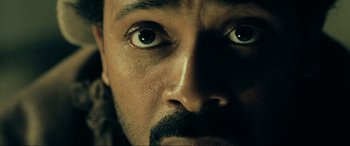 Movie still from “Resident Evil: Extinction” (2007), directed by Russell Mulcahy – A man's eyes and a mustache; Extreme Close Up shot, High angle