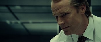 Movie still from “Resident Evil: Extinction” (2007), directed by Russell Mulcahy – A person wearing a white shirt; Close Up shot, Low angle