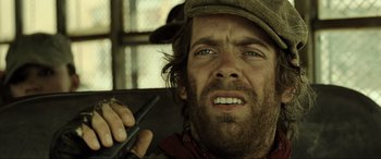 Movie still from “Resident Evil: Extinction” (2007), directed by Russell Mulcahy – A person holding a cell phone; Close Up shot, Low angle