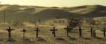 Movie still from “Resident Evil: Extinction” (2007), directed by Russell Mulcahy – Three crosses in the middle of the desert; Extreme Wide shot, High angle