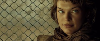 Movie still from “Resident Evil: Extinction” (2007), directed by Russell Mulcahy – A person wearing a brown jacket; Close Up shot, Low angle