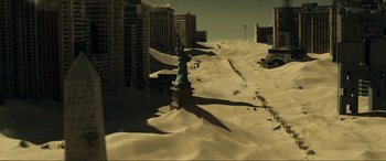 Movie still from “Resident Evil: Extinction” (2007), directed by Russell Mulcahy – The statue of liberty stands in the middle of the desert; Extreme Wide shot, High angle