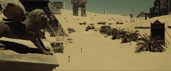 Movie still from “Resident Evil: Extinction” (2007), directed by Russell Mulcahy – An image of a desert scene with buildings in the background; Extreme Wide shot, High angle
