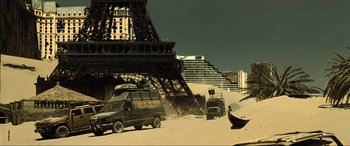 Movie still from “Resident Evil: Extinction” (2007), directed by Russell Mulcahy – A van parked in front of the eiffel tower; Extreme Wide shot, Low angle