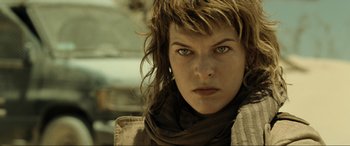 Movie still from “Resident Evil: Extinction” (2007), directed by Russell Mulcahy – A person wearing a scarf; Close Up shot, Low angle