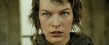 Movie still from “Resident Evil: Extinction” (2007), directed by Russell Mulcahy – A woman's face with green eyes; Close Up shot, Low angle